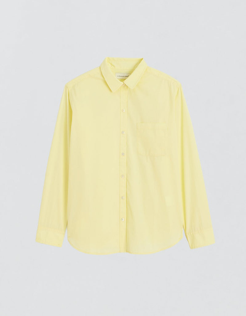 Yellow button down shirt on a light gray background