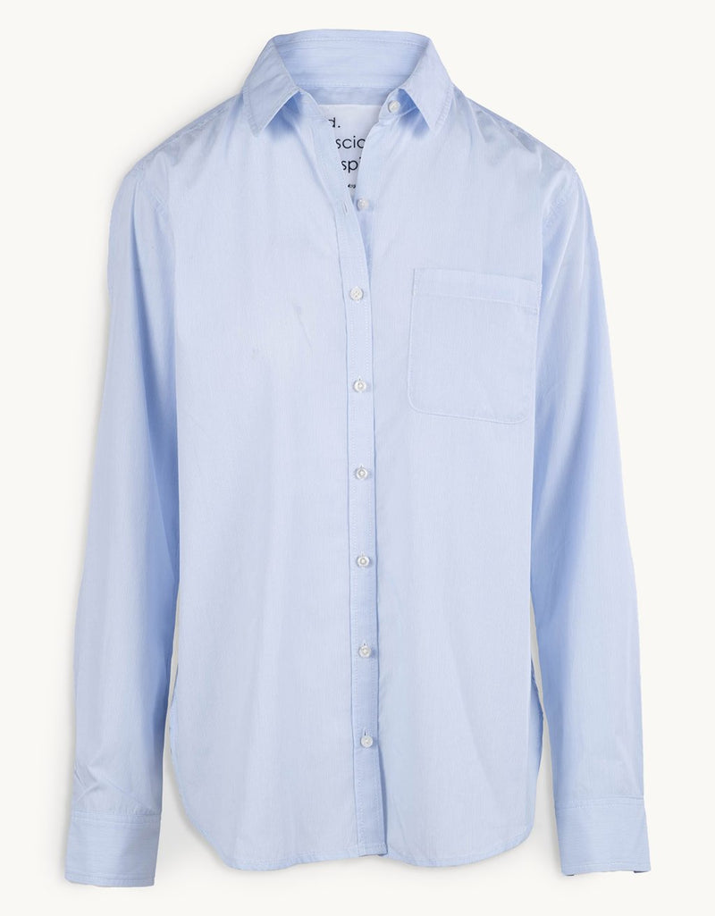 Light blue button down shirt on a white background