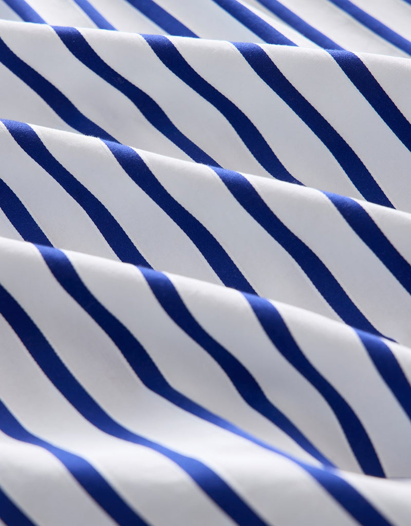 Close-up of cobalt blue and white striped satin jacquard fabric