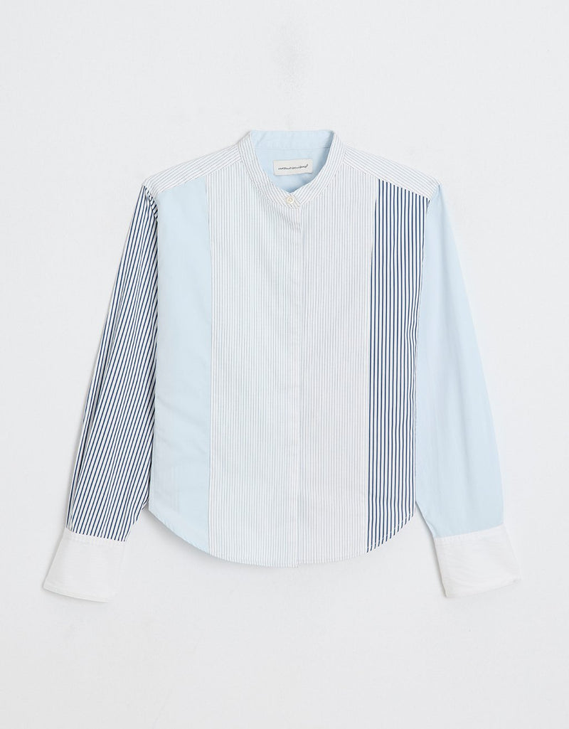Striped colorblock tuxedo button down shirt on a light gray background