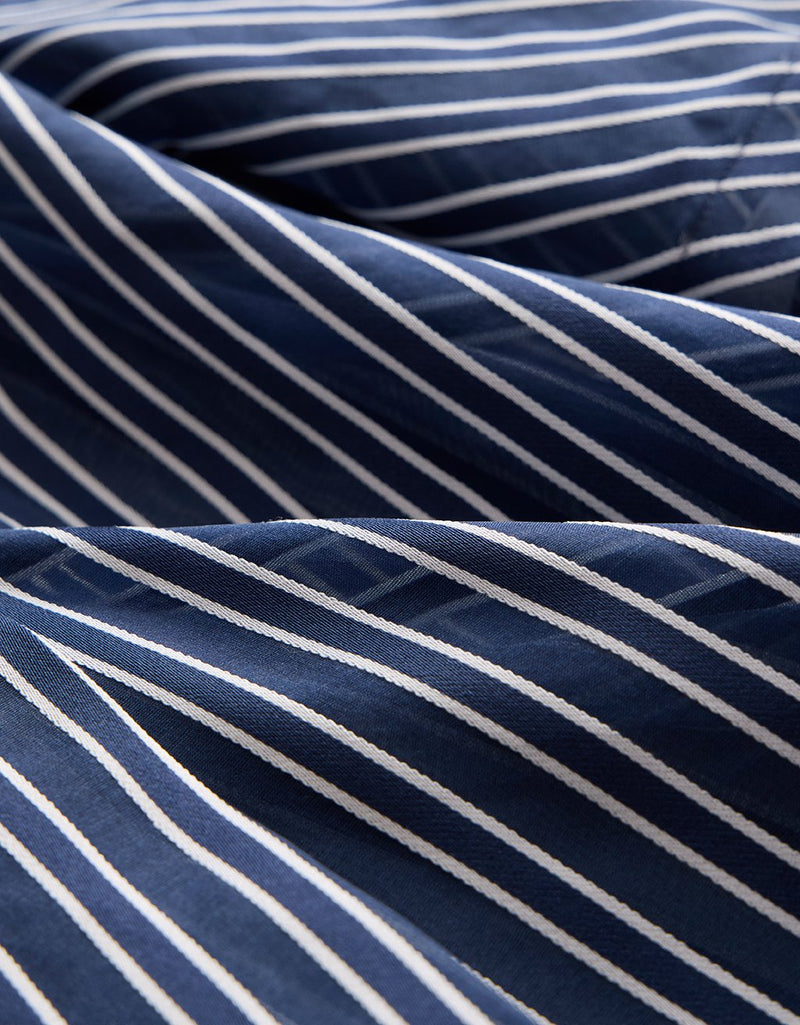 Close-up of navy and white striped organza fabric