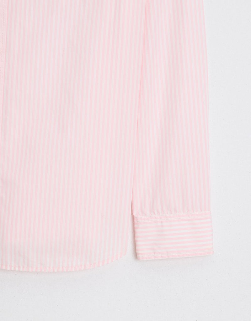 Close-up of a light pink colorblock stripe boyfriend shirt with a light gray background