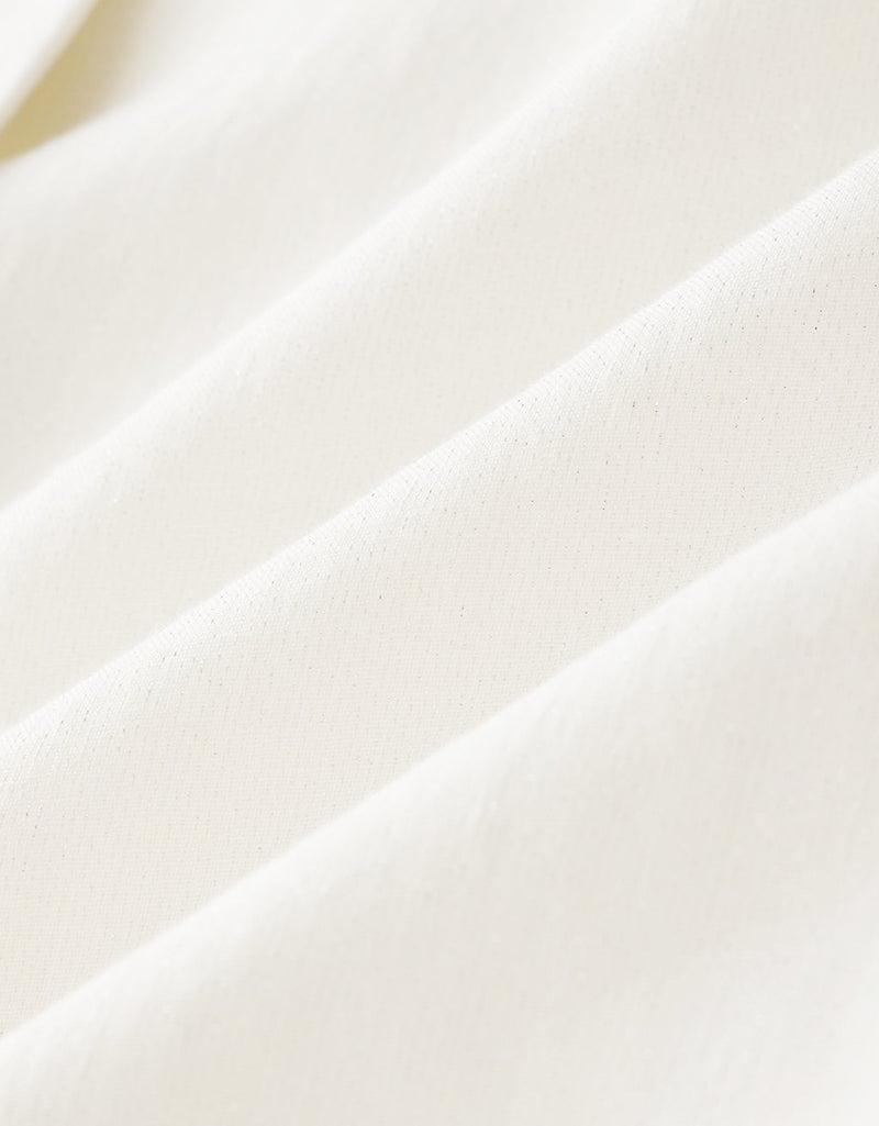 Close-up of white fabric with a subtle texture