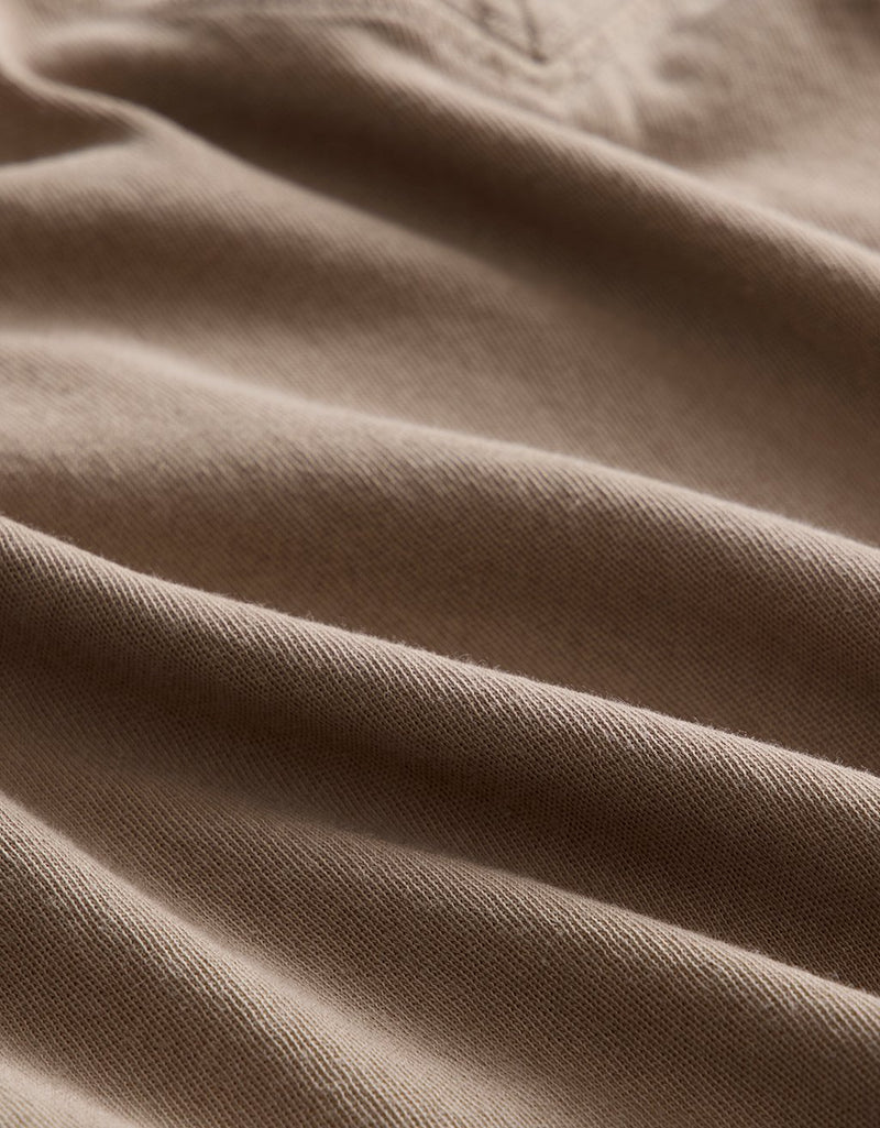 Close-up of beige fabric with visible texture