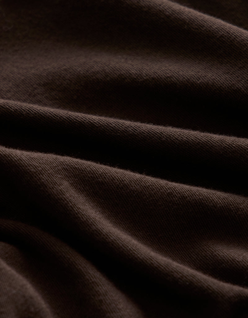 Close-up of dark brown fabric texture