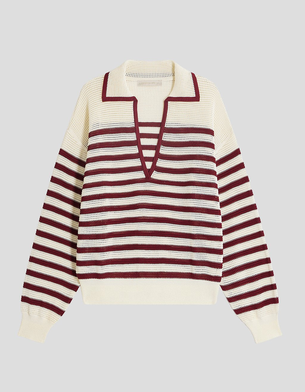 Open knit red striped polo sweater with a deep V-neckline on a light gray background