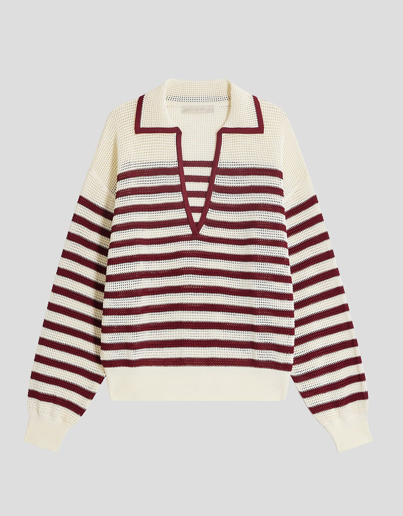 Open knit red striped polo sweater with a deep V-neckline on a light gray background