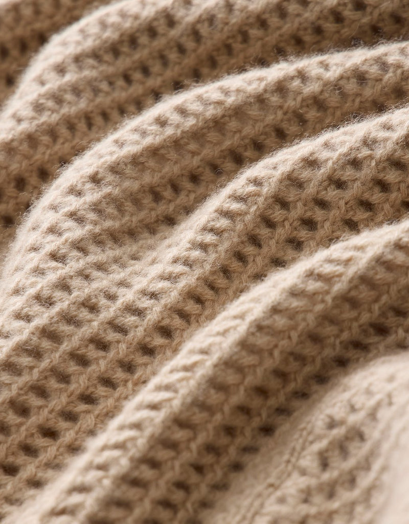 Close-up of camel open-stitch cashmere texture