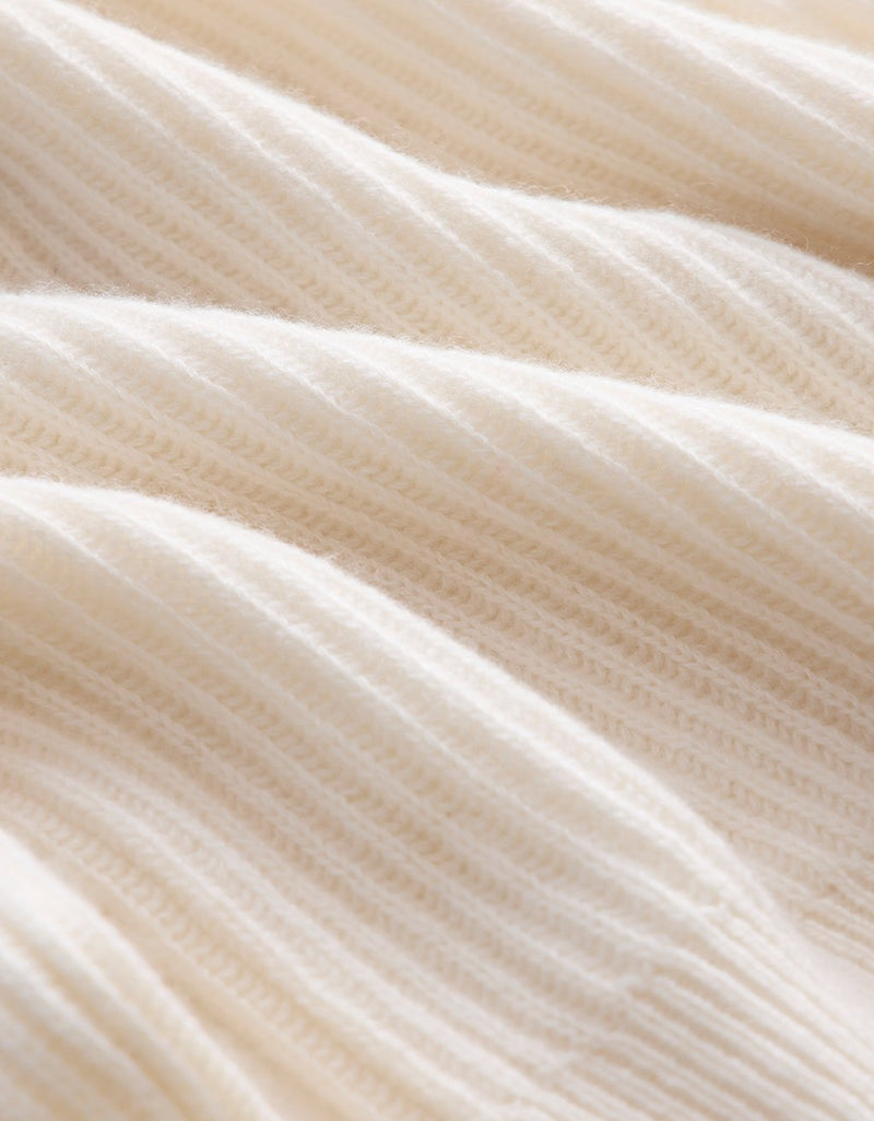 Close-up of ivory cashmere fabric texture