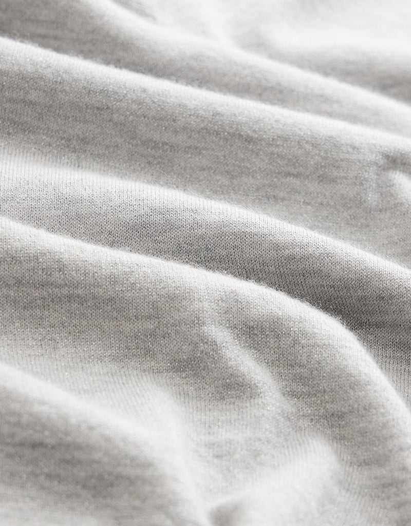 Close-up of gray cashmere fabric with folds