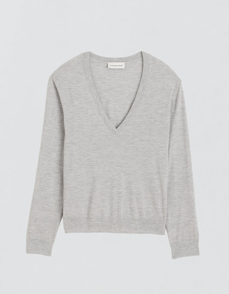 Gray V-neck cashmere sweater on a light gray background