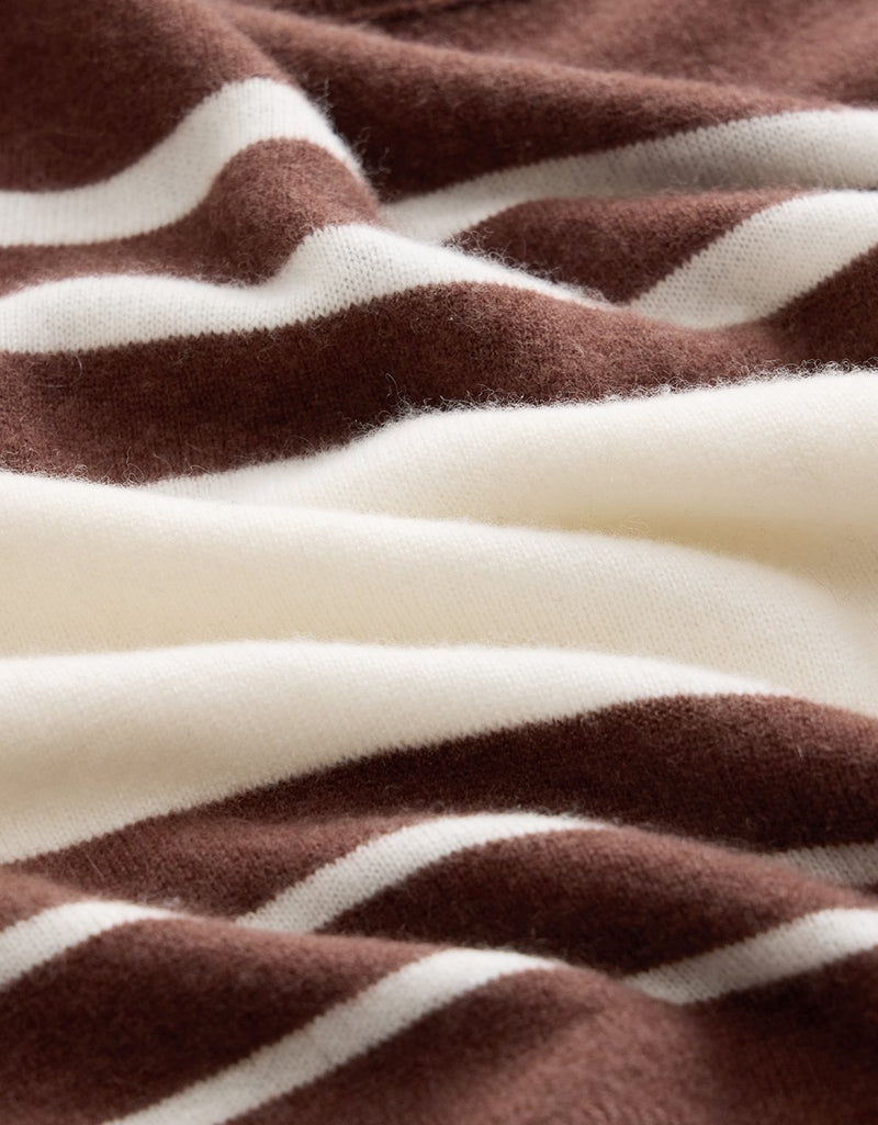 Close-up of brown and white striped cashmere fabric texture