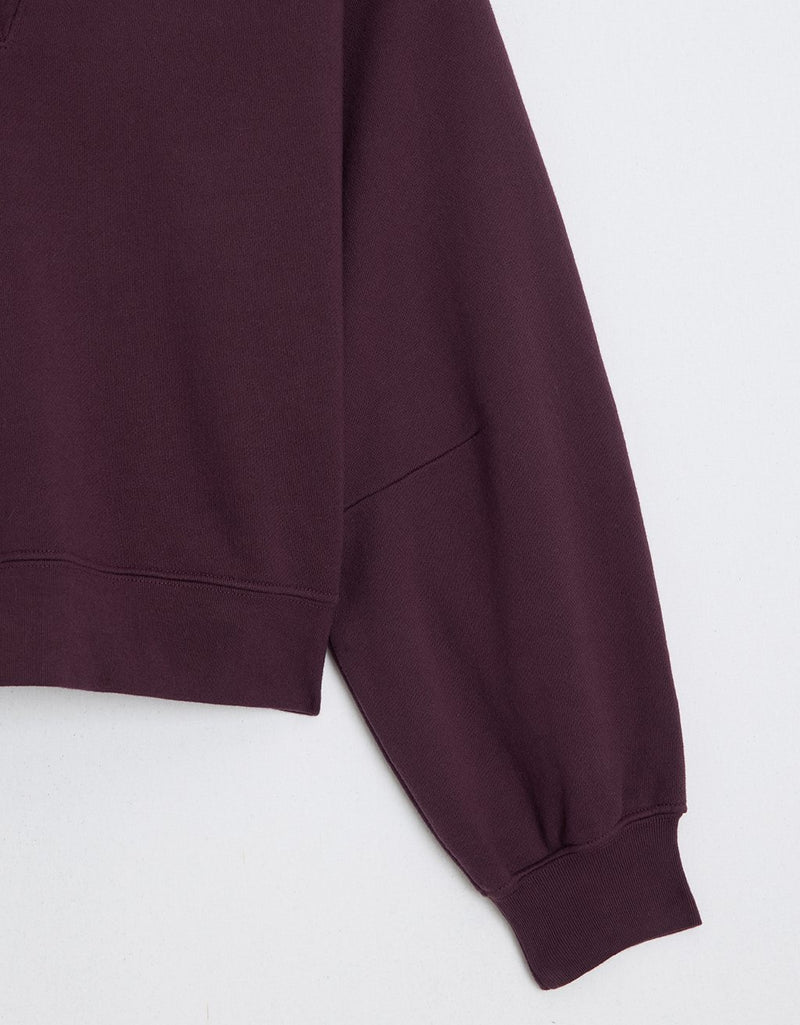 Close up of a burgundy polo sweatshirt