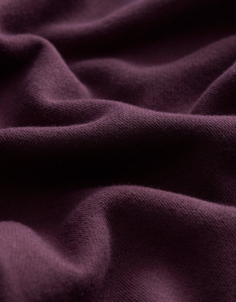 Close-up of burgundy fabric with folds