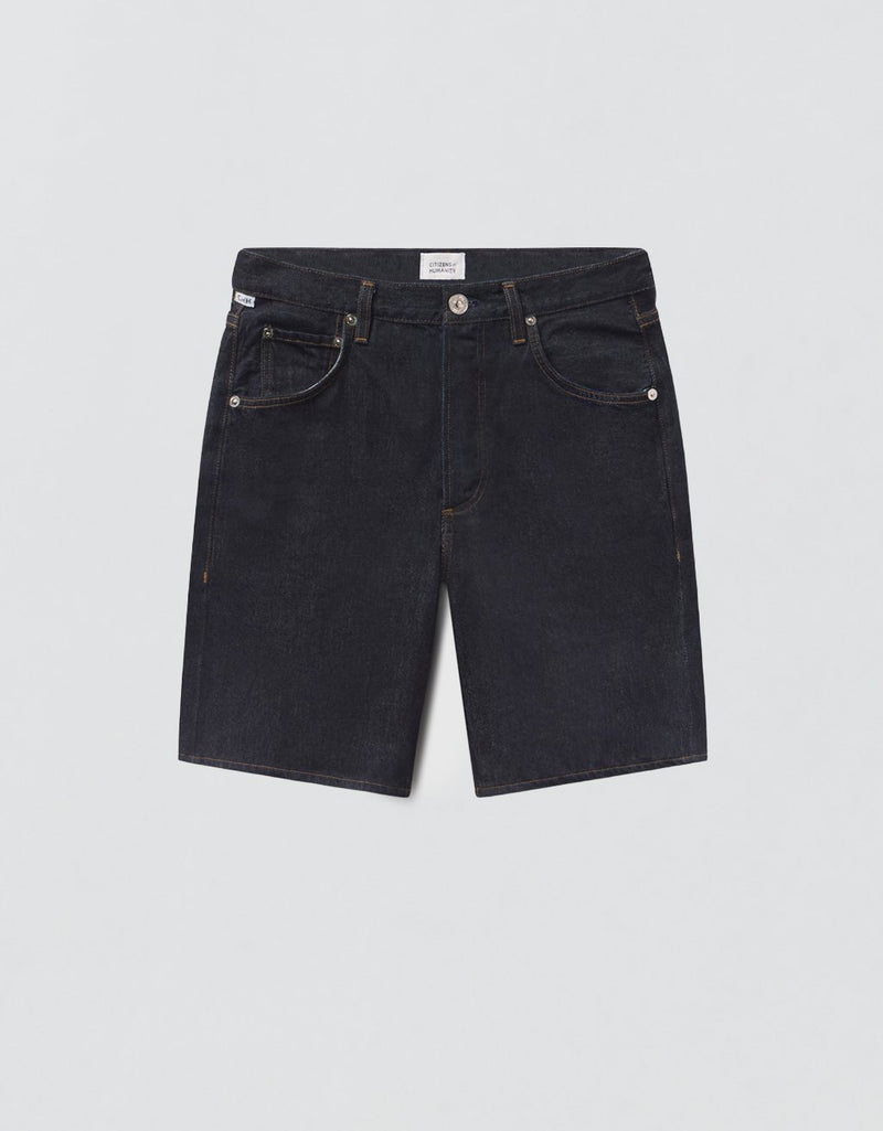 Dark denim shorts on a light gray background