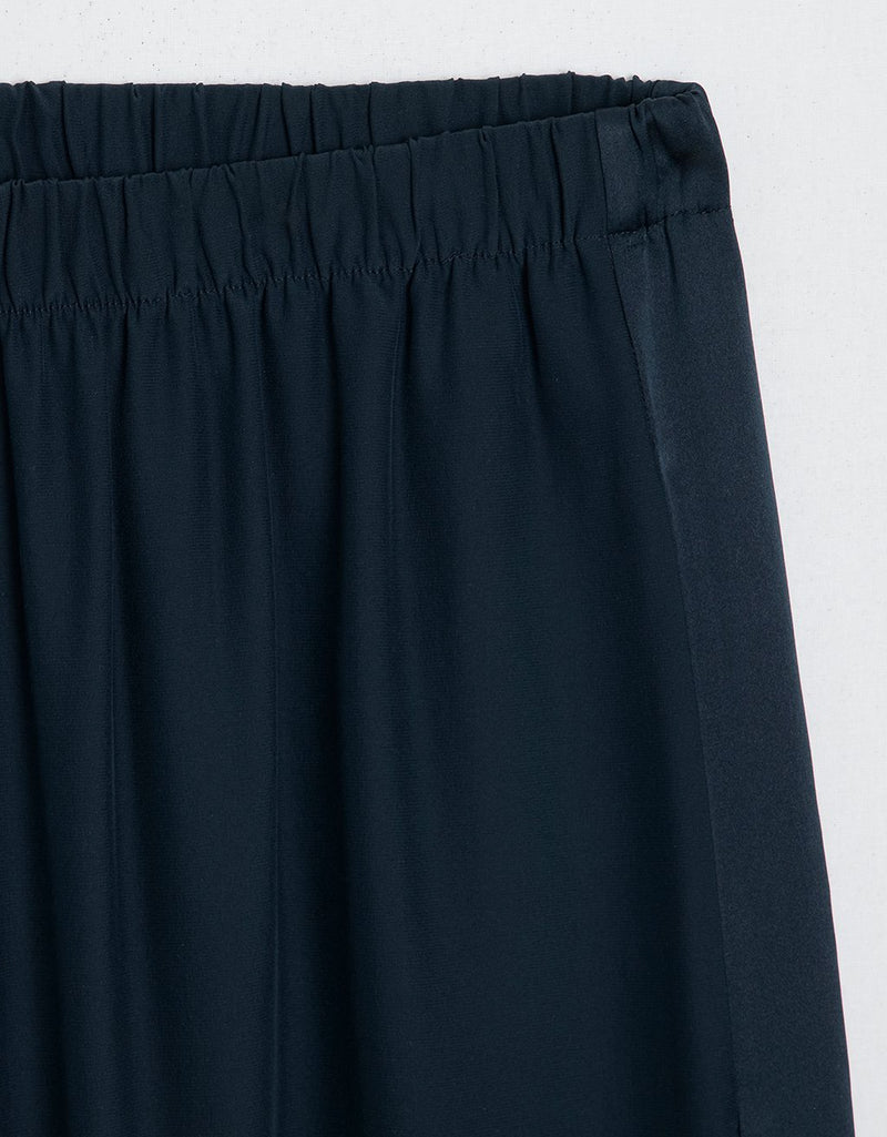 Navy blue pants with an elastic waistband on a white background