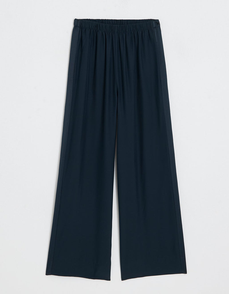 Navy blue wide leg pants on a light gray background