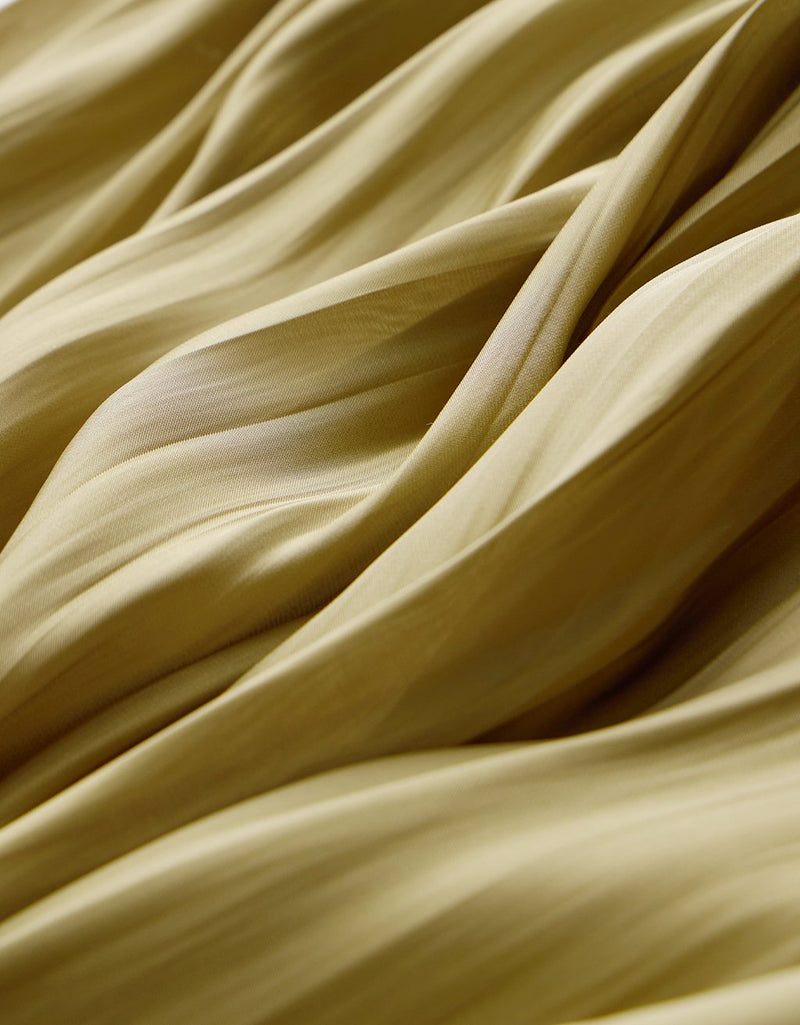 Close-up of olive fabric with folds