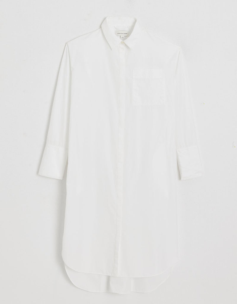 White shirtdress on a plain background