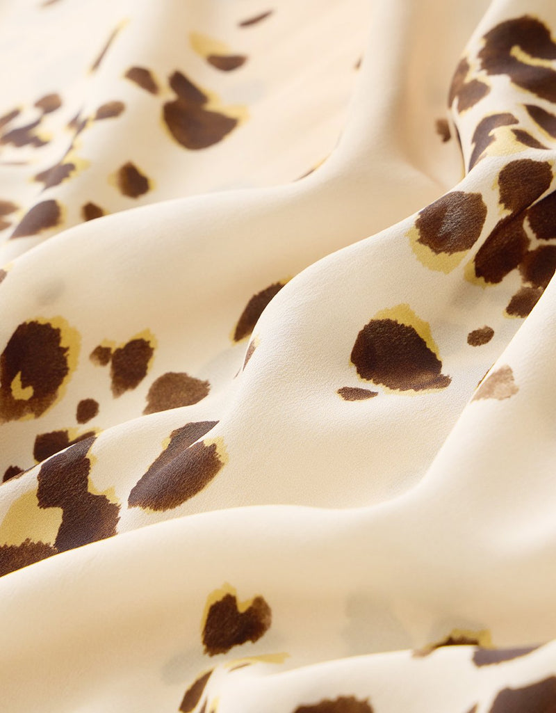 Close-up of fabric with a brown dot pattern 