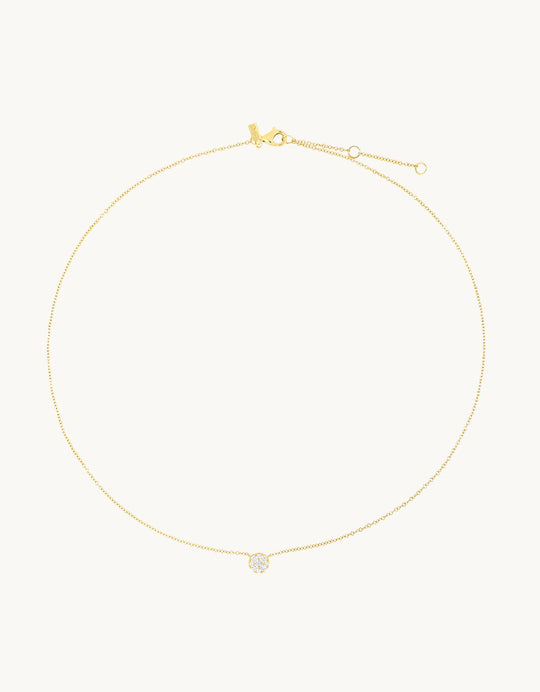 14k yellow gold necklace with a small diamond pendant on a light gray background