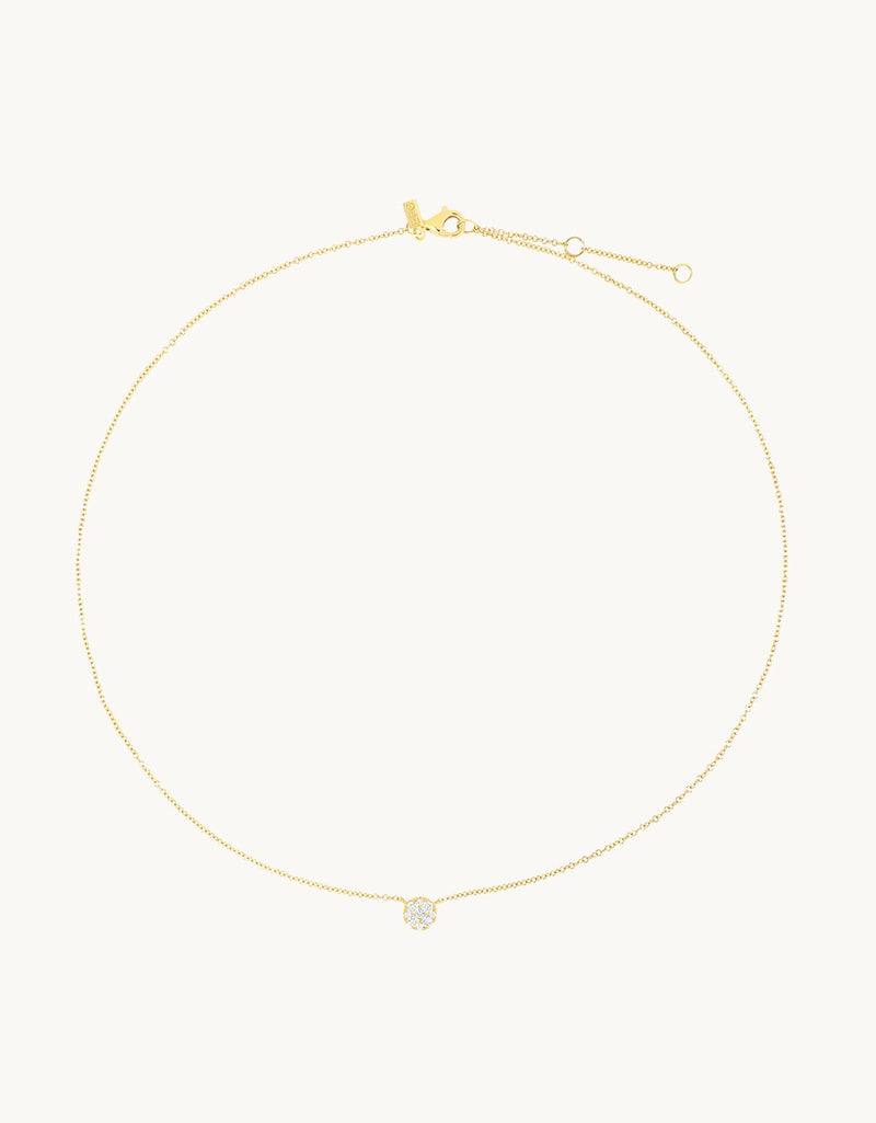 14k yellow gold necklace with a small diamond pendant on a light gray background