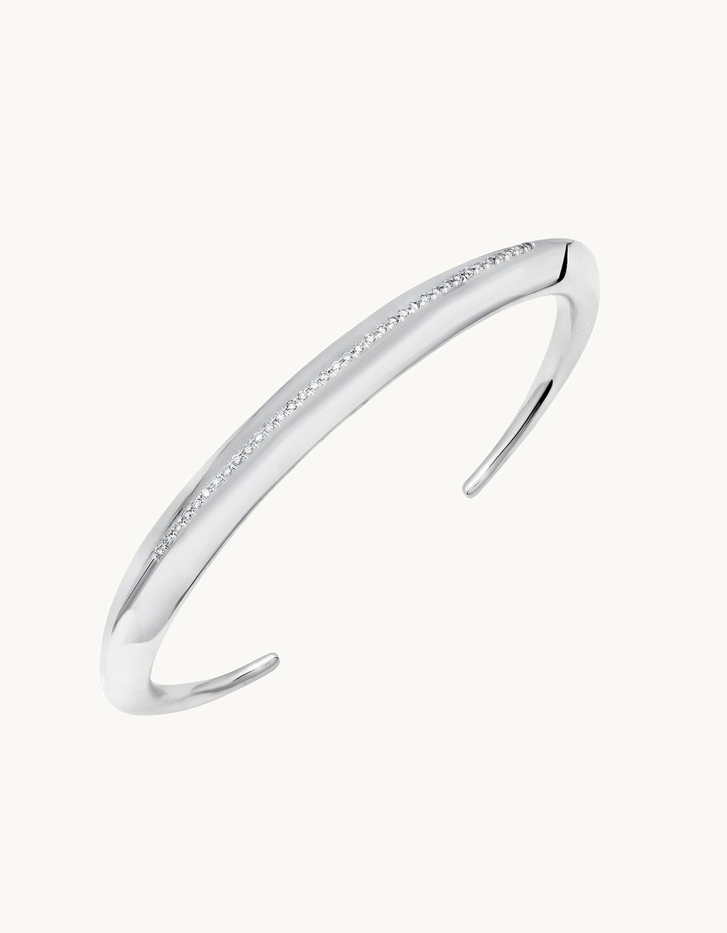 Silver bracelet with diamond accents on a plain background