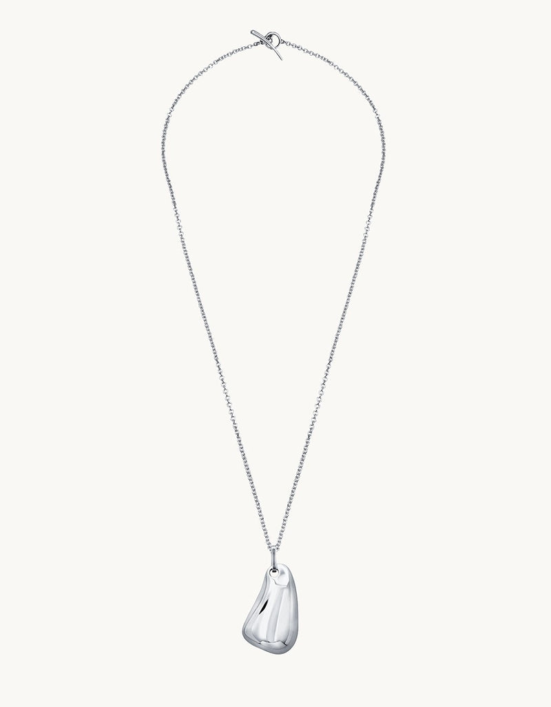 Silver necklace with a teardrop-shaped pendant on a plain background