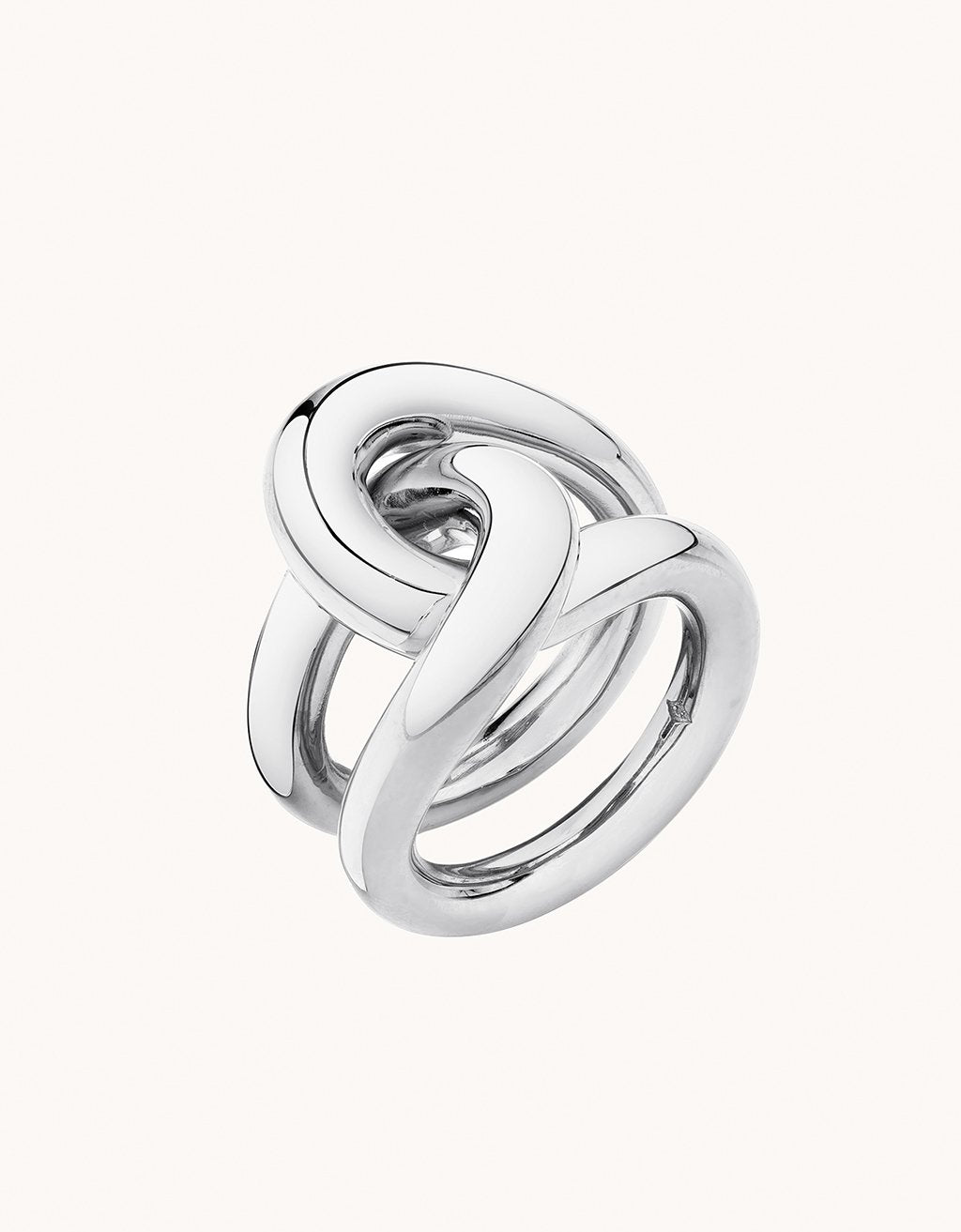 Silver ring with a unique link design on a plain background