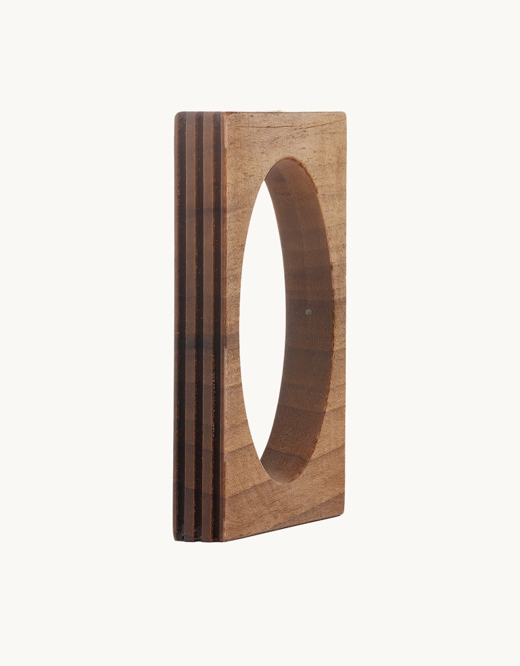 Square wooden bracelet with oval cutout on a light gray background