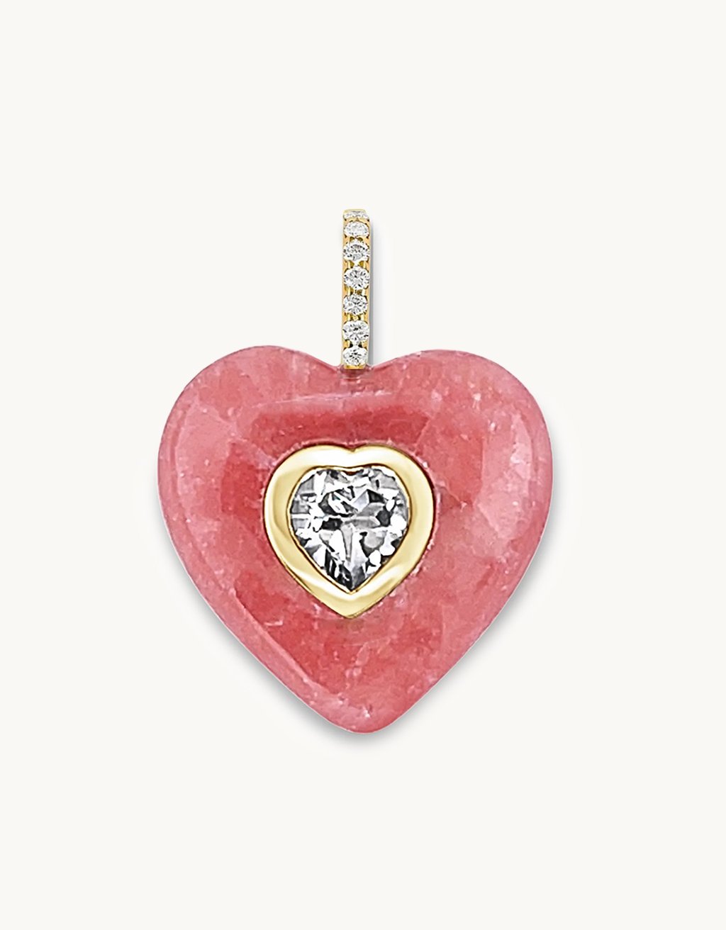 Heart-shaped pendant carved from genuine Pink Rhodochrosite gemstone with a crystal quartz center stone and diamond bail on a light gray background