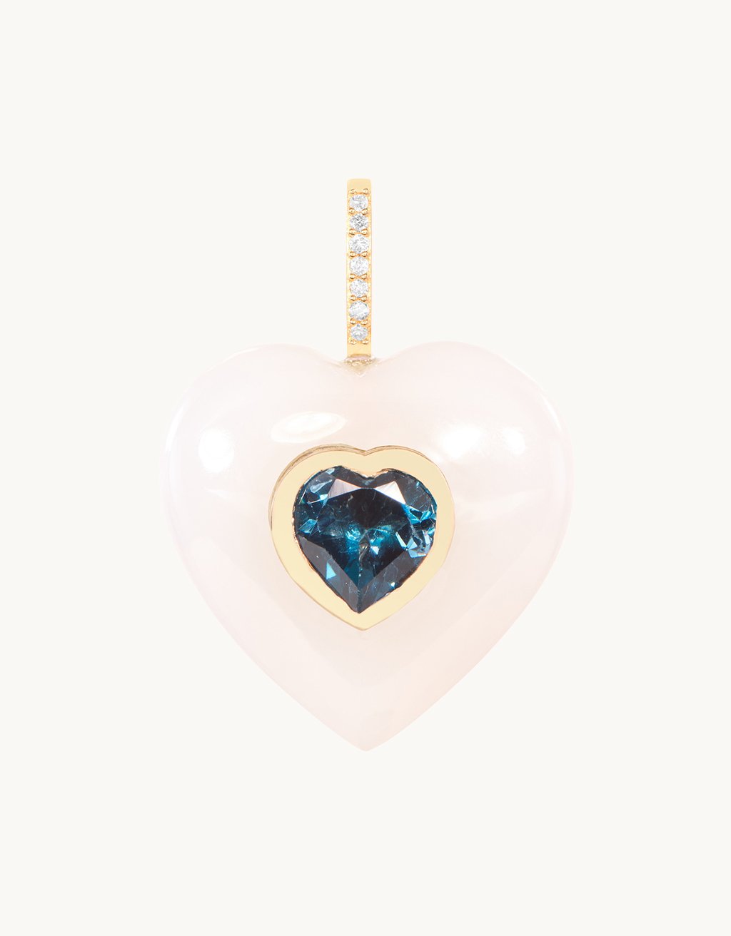 Heart-shaped pendant carved from genuine White Onyx gemstone with a single Blue Topaz center stone and diamond bail