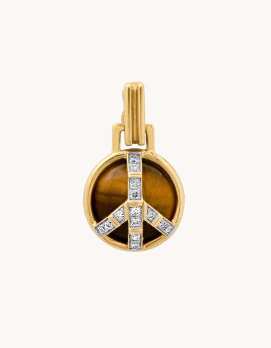 Gold peace sign pendant with a tiger's eye stone and diamond accents on a light gray background