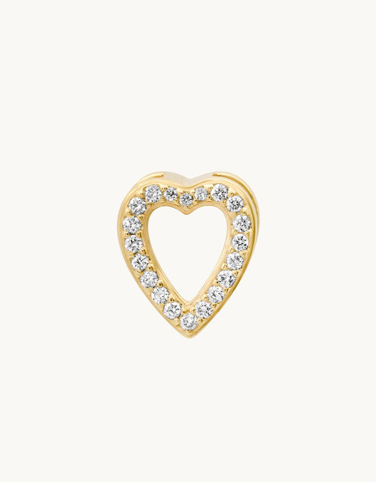 Gold heart-shaped charm with diamond accents on a plain background