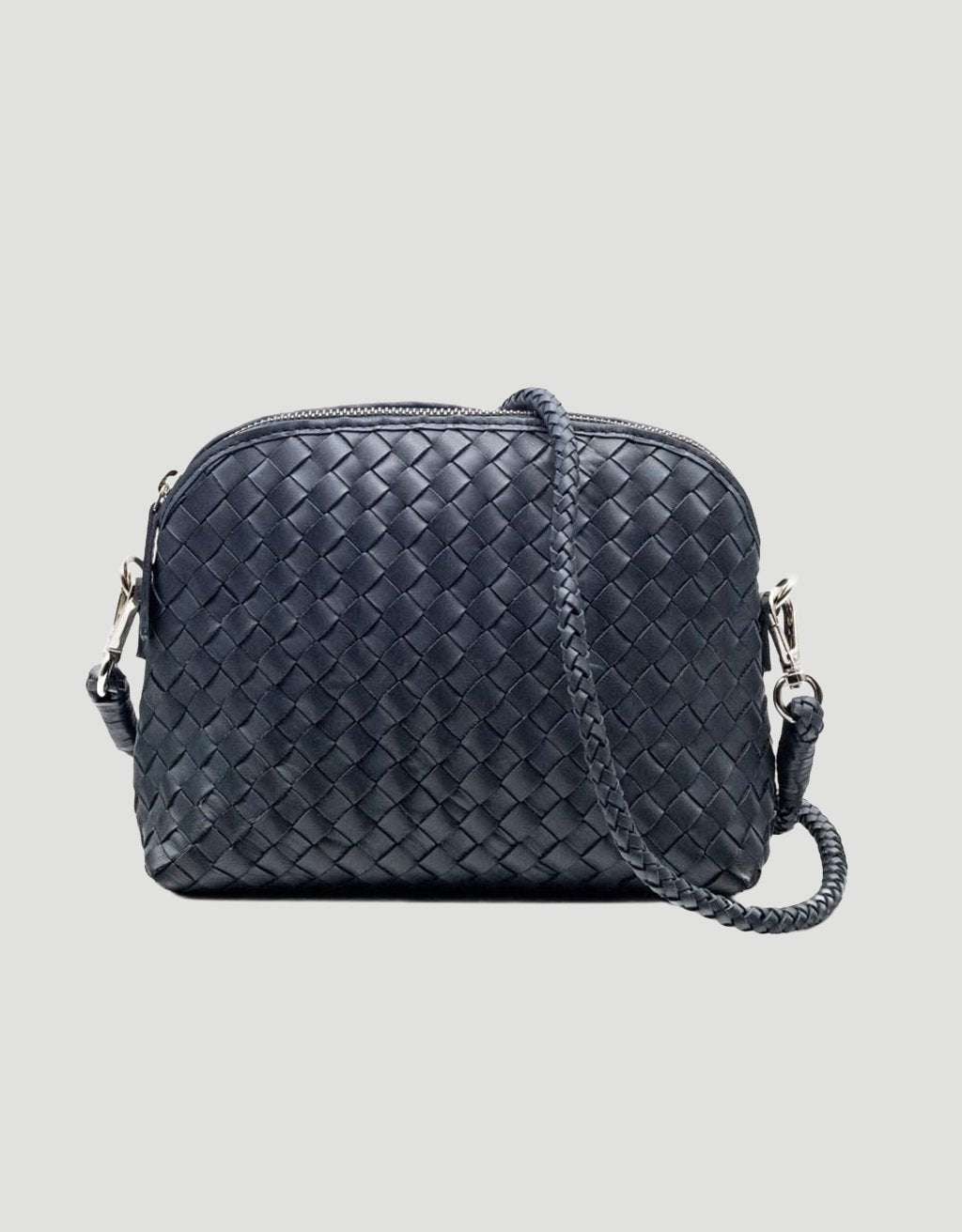 Navy woven handbag with detachable shoulder strap on a light gray background