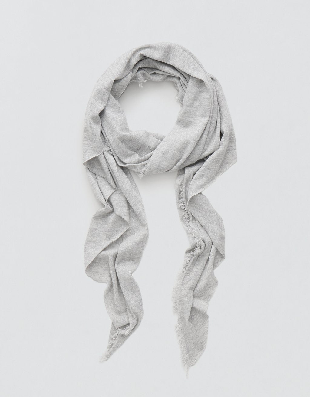 Gray cashmere scarf with Lurex accents draped over a light gray background