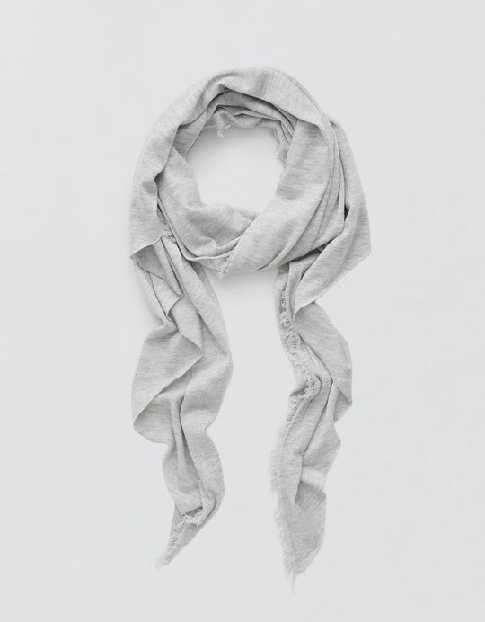 Gray cashmere scarf with Lurex accents draped over a light gray background
