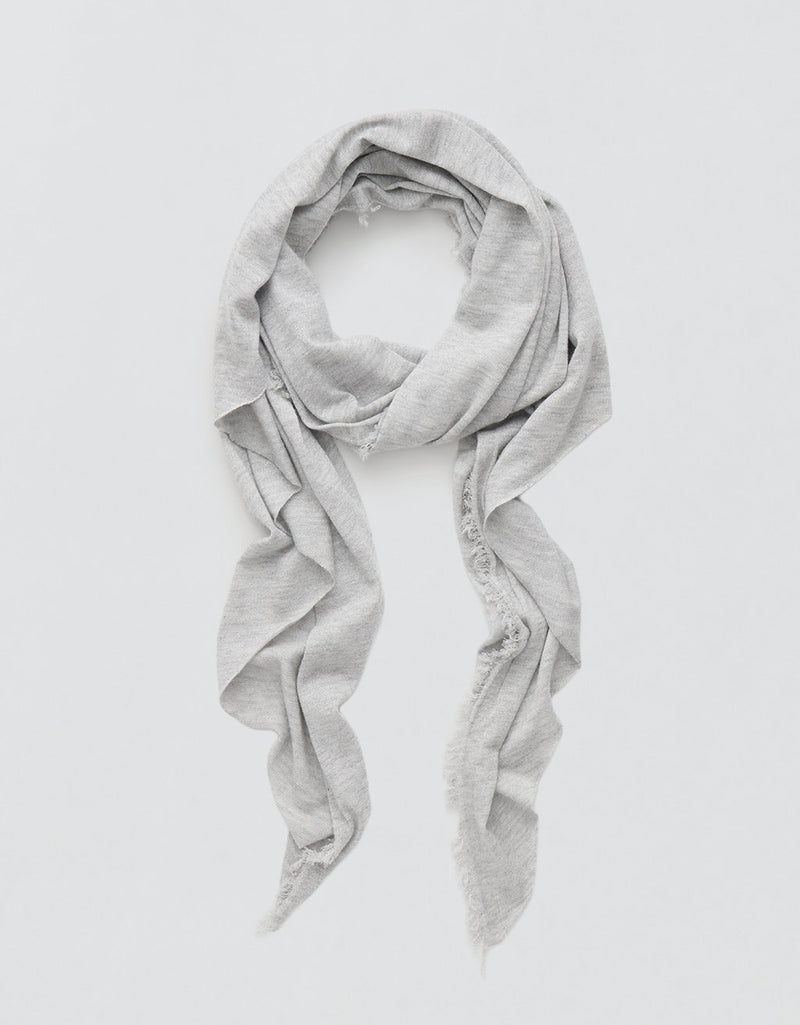 Gray cashmere scarf with Lurex accents draped over a light gray background
