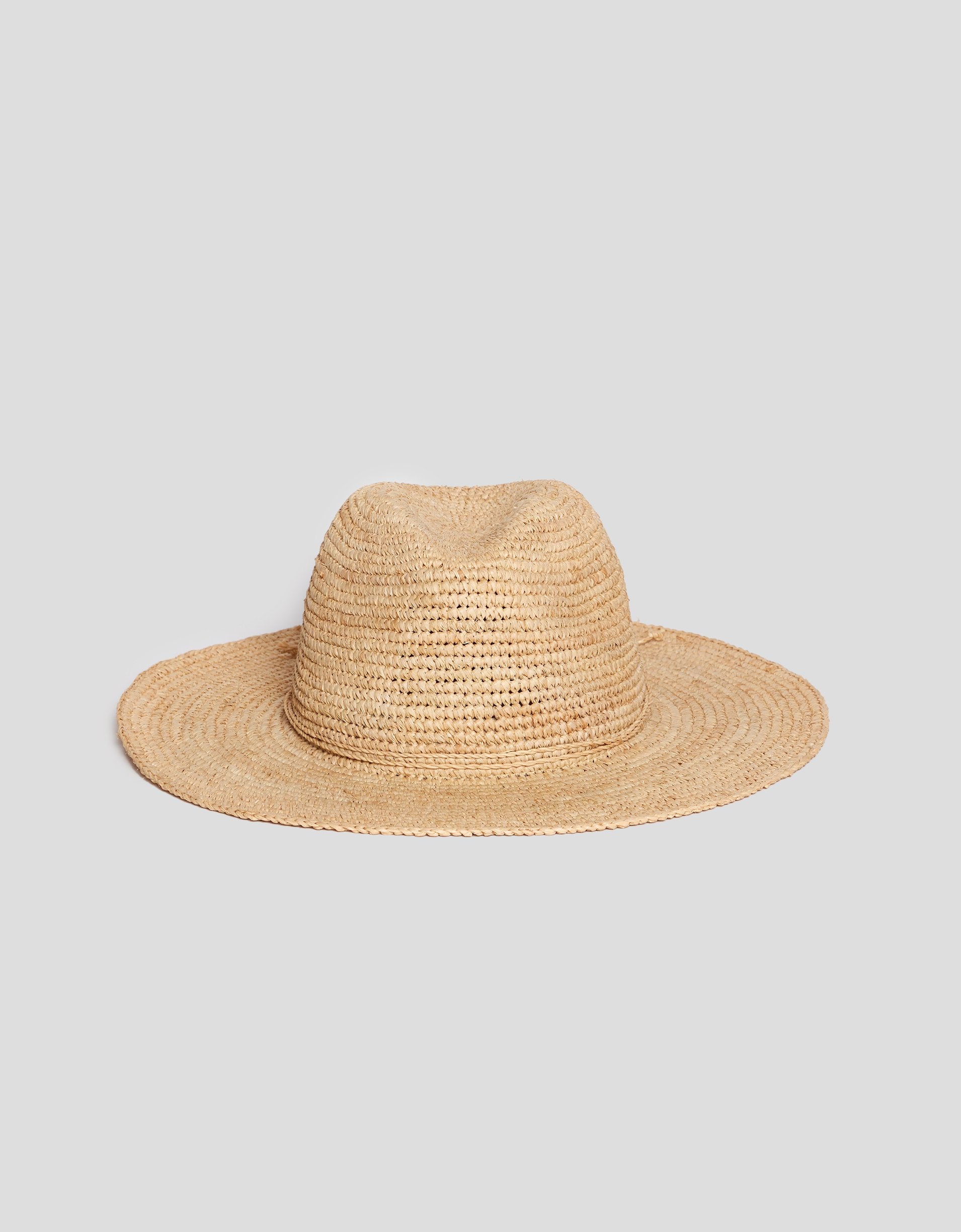 Beige straw hat on a light gray background